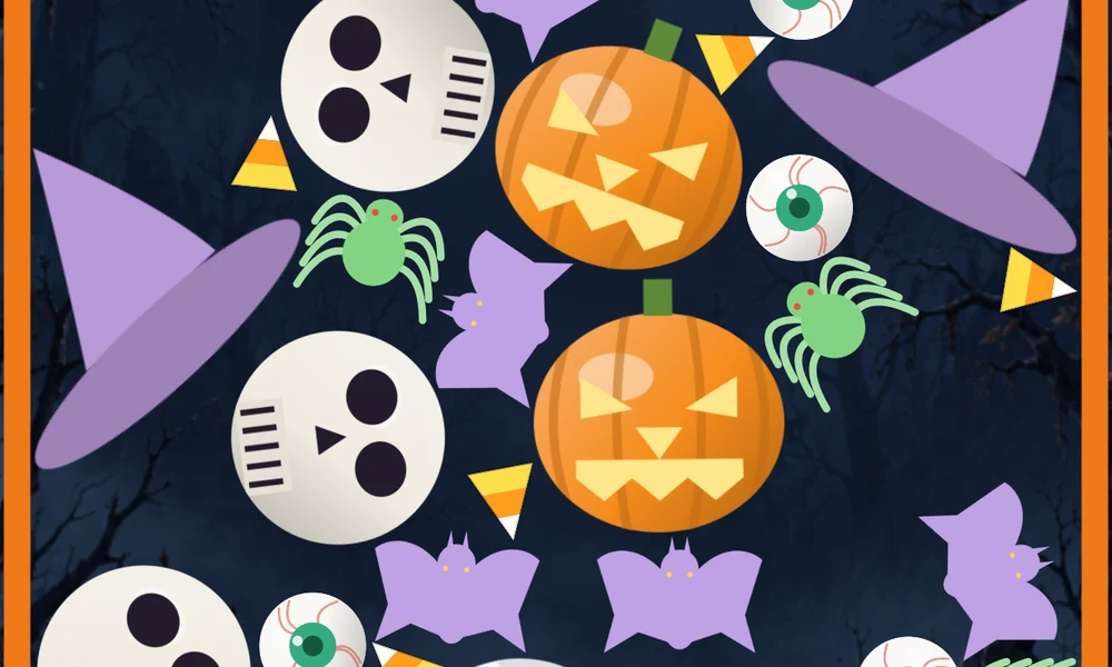 Two matching jack-o’-lanterns sit in the pile among skulls and witch hats.